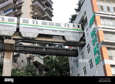 A Monorail Train Of Chongqing Light Rail Line 2 Is Running Through A