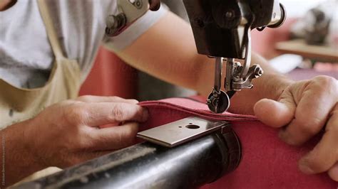 Sewing Machine Being Used By A Man By Stocksy Contributor J Esteban