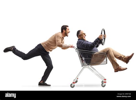 Guy Pushing A Mature Man Inside A Shopping Cart Holding A Steering