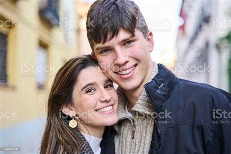 Portrait Of Young People In Love Looking At The Camera Stock Photo