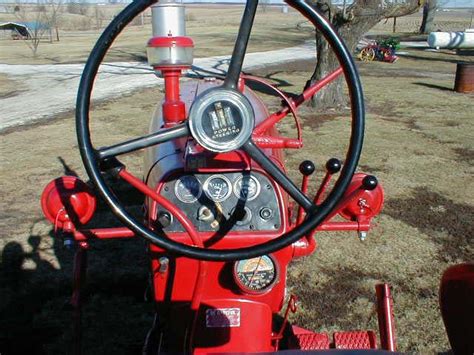 Restored Farmall 450 tractor with wide front for sale