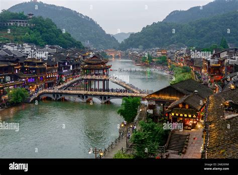 Traditional Chinese Architecture Flanks The Tower Footbridge Over The