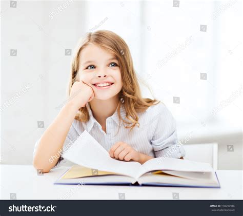 Education And School Concept Little Student Girl Studying At School