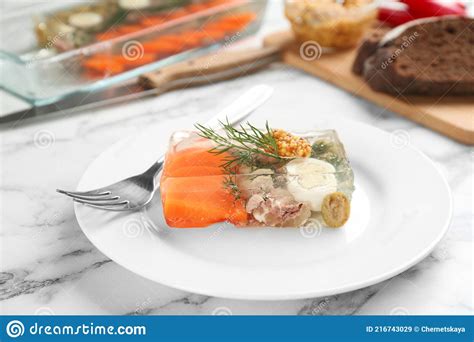 Delicious Aspic With Meat And Vegetables Served On White Marble Table