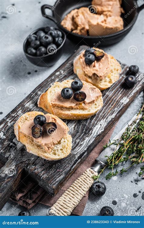 Toast With Foie Gras Pate And Fresh Blueberry On Wooden Board Gray