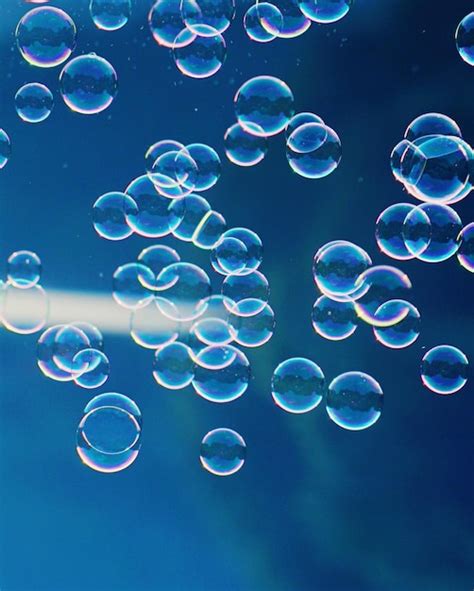 Premium Photo Close Up Of Bubbles Against Blue Water