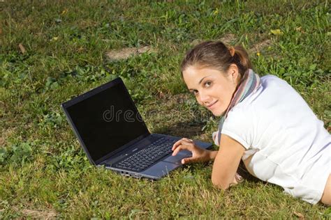 Woman Laying In Green Grass And Working On Laptop Stock Image Image