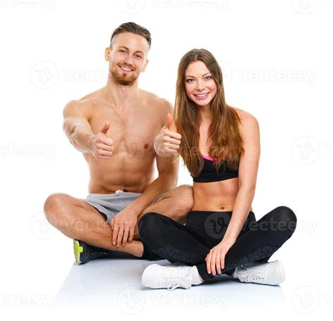 Sport Man And Woman After Fitness Exercise With A Finger Up On The