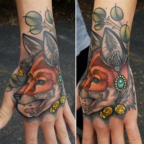 Two Hands With Tattoos On Them One Has A Fox And The Other Has An Owl