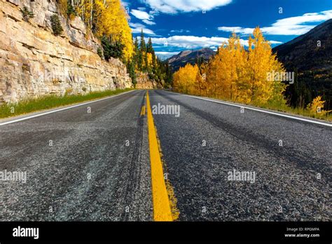 Autumn road with yellow line goes from Ouray to Silverton Colorado, the ...