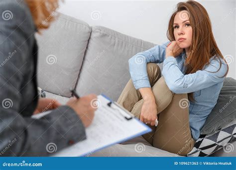 Female Psychologyst Therapy Session With Client Indoors Sitting Girl