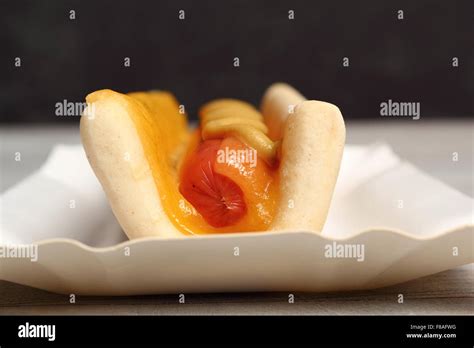 Hot Dog with Mustard Stock Photo - Alamy