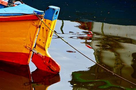 Premium Photo Reflection Of Boat Moored In Lake