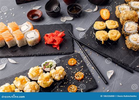 Various Kinds Of Sushi Served On Black Stone Sushi Set Stock Photo