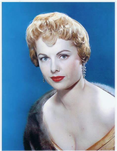 An Old Photo Of A Woman With Red Hair And Blue Eyes Wearing A Fur Coat