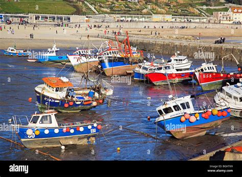 Colourful Fishing Boats In Lyme Regis Harbour Dorset England Uk