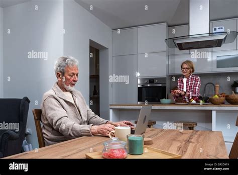 Happy Senior Mature Man Husband Remote Working Or Distance Learning Online From Home Office