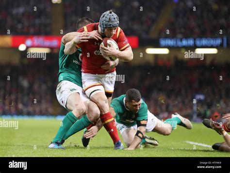 Wales Jonathan Davies Is Tackled By Irelands Johnny Sexton During The