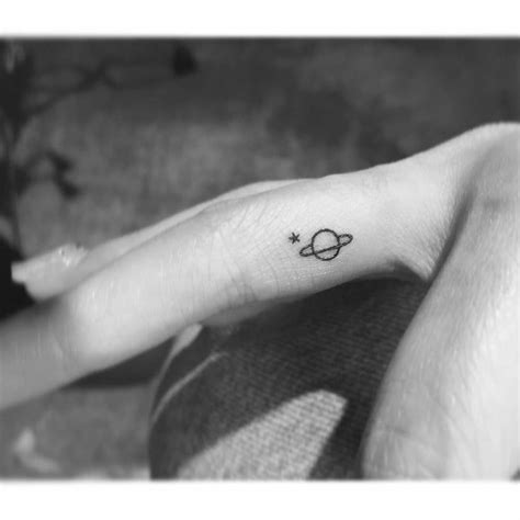 Minimalistic Saturn And Star Tattoo Located On The Saturn Tattoo