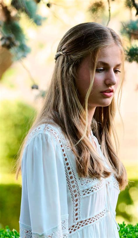 A Woman With Long Hair Wearing A White Dress