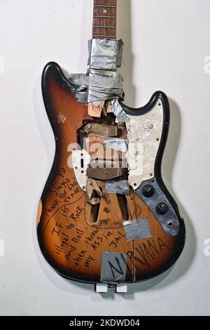 A Fender Mustang Guitar Owned Stage Played Smashed And Signed By