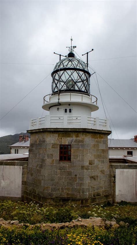 Vertical Shot Of Estaca De Bares Lighthouse In Bares Spain Stock Photo