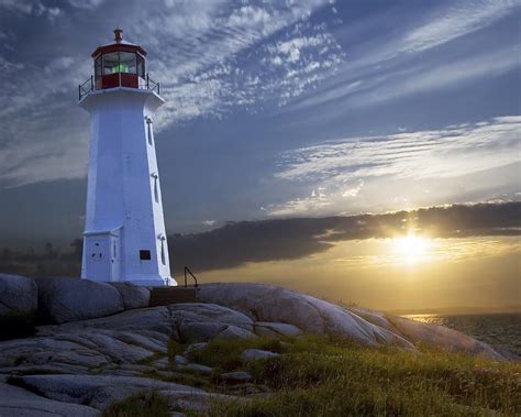 Sunset At Peggys Cove Lighthouse By Randall Nyhof