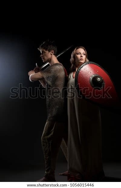 Young Viking Holding Sword His Beautiful Stock Photo 1056015446