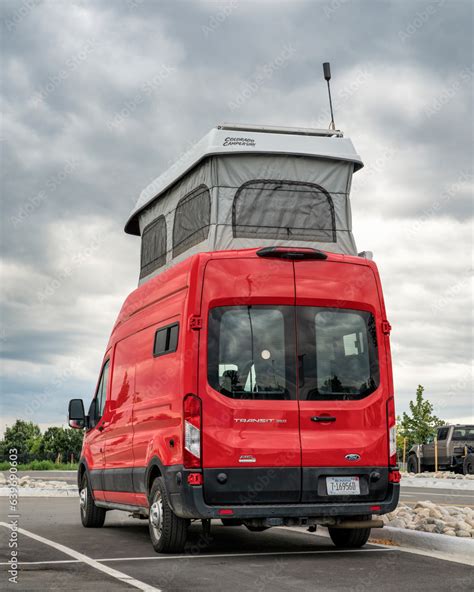 Loveland, CO, USA - August 25, 2023: Ford Transit 350 camper - conversion with pop top by ...