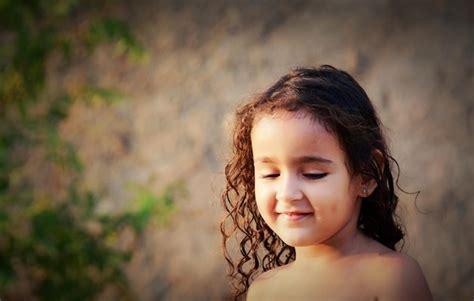 Premium Photo Close Up Of Shirtless Girl Smiling Against Wall