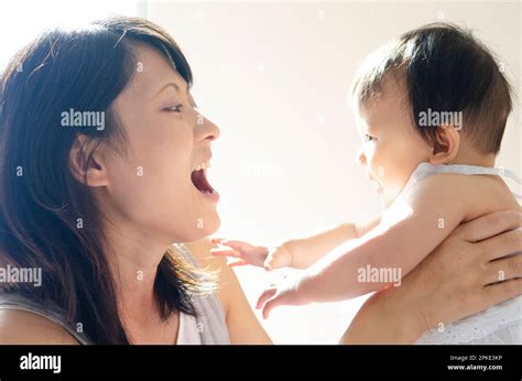 Mother nursing her baby Stock Photo - Alamy