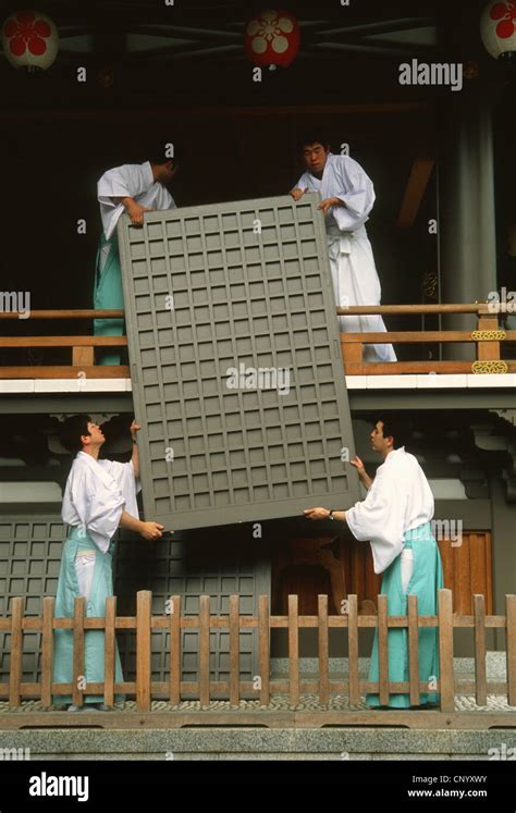 Japan Tokyo Yushima Tenjin Shinto Shrine Attendants Working Stock