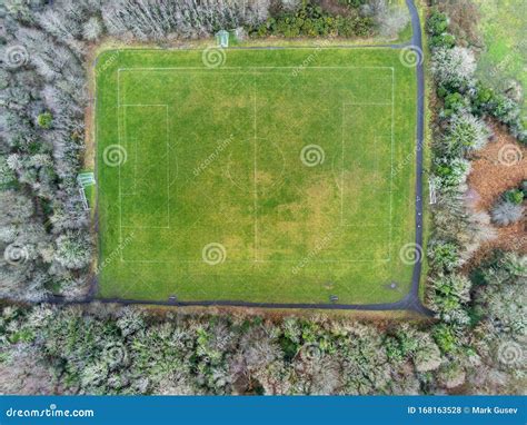 Aerial View On A Football Field Surrounded By Trees In A Park Stock