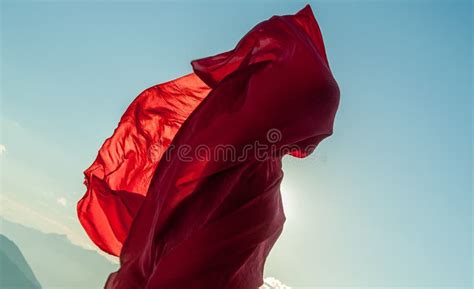 Woman Wrapped In A Red Scarf In The Wind Nn Stock Photo Image Of