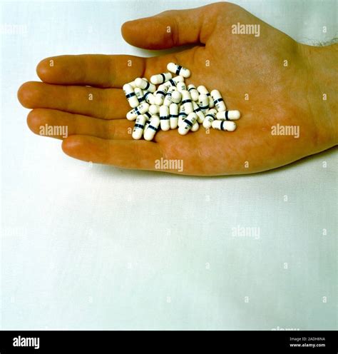 Aids Drug Capsules Hand With Capsules Of The Drug Azt