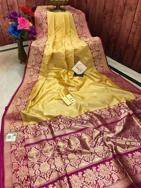 Buttery Yellow And Magenta Color Katan Banarasi Silk Raw Silk Saree