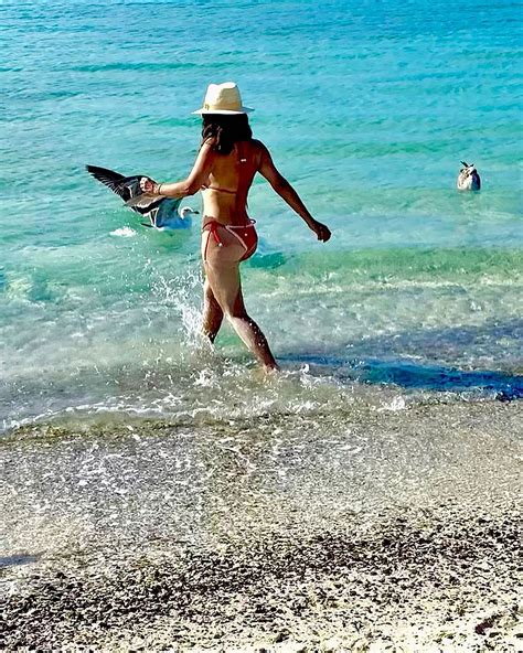 Salma Hayek Shows Off Her Incredible Figure In Tiny Red Bikini As She Plays In Water During
