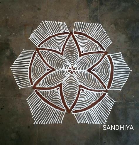 An Intricately Designed Design On The Ground In White And Brown Colors