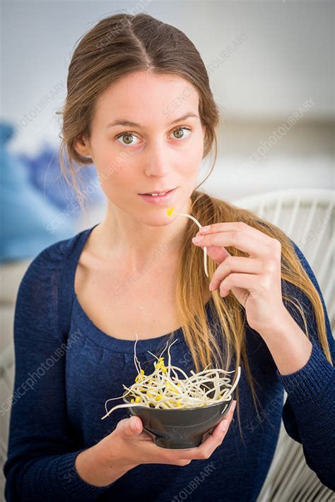 Woman Eating Soybean Sprouts Stock Image C Science Photo