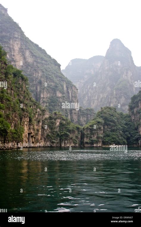 Steep High Cliffs And The River At The Bottom Of The Gorge Stock Photo