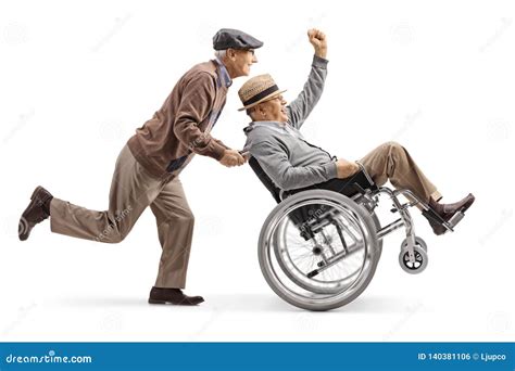 Senior Man Pushing A Positive Disabled Man In A Wheelchair Gesturing