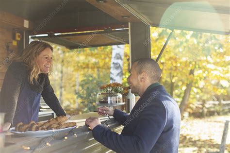 Happy Friendly Food Cart Owner Talking With Customer Stock Image