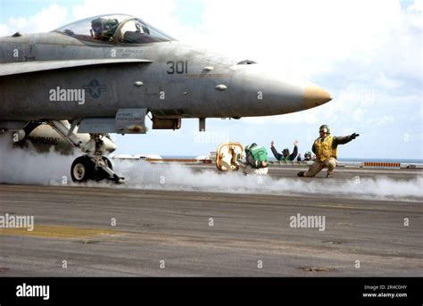 Us Navy An Aircraft Shooter Gives The Signal To Launch An F A C