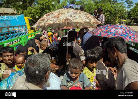 Refugees are transported to the Kutupalong refugee camp in open trucks ...