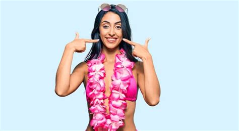 Beautiful Hispanic Woman Wearing Bikini Hawaiian Lei Showing Pointing