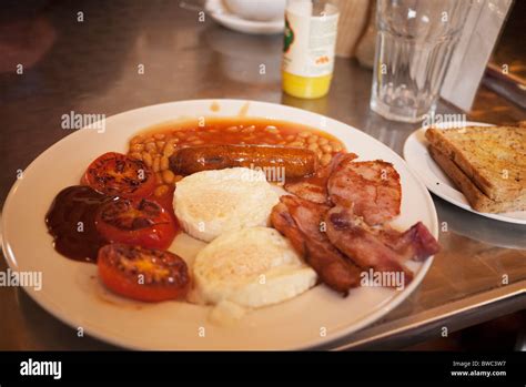 A Full English Breakfast On A Plate In A Greasy Spoon Cafe Also