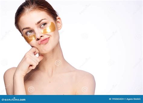 Woman Cares For Face Skin Patches Under The Eyes Cosmetology Naked Shoulders Emotions Model