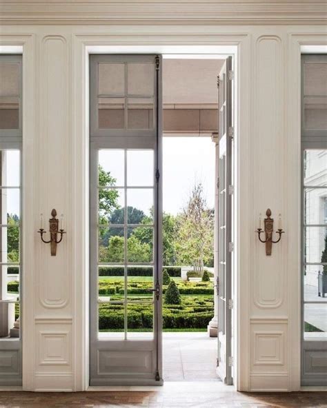 White Walls With Molding And Antique Gold Brass Sconces Tall Grey