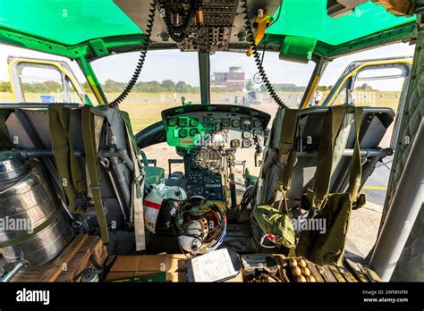 Interior, 1960's US decommission Bell Huey UH1 Iroquois Helicopter. Pilot and co-pilot's seat ...