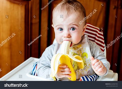 Cute Baby Eating Banana Stock Photo 264582764 | Shutterstock